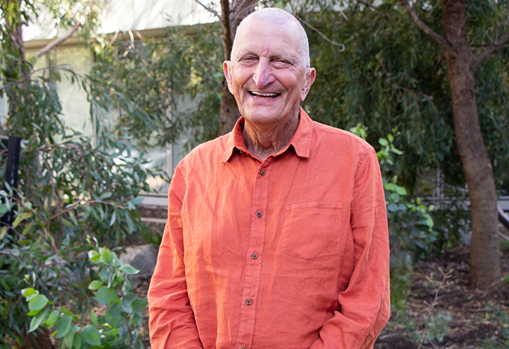 A man stands smiling at camera