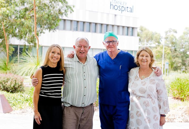 Rod and wife Roxy standing with Clare Fazackerley and Professor Robert Larbalestier out the front of Fiona Stanley Hospital.